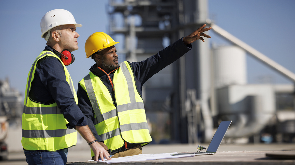 Engineers discussing at industrial facility